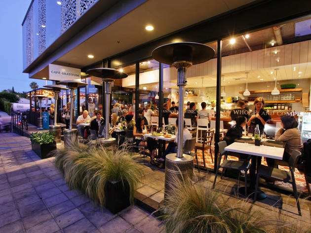 people outside the Café Gratitude having coffee 